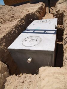 a new septic tank being installed on a construction site